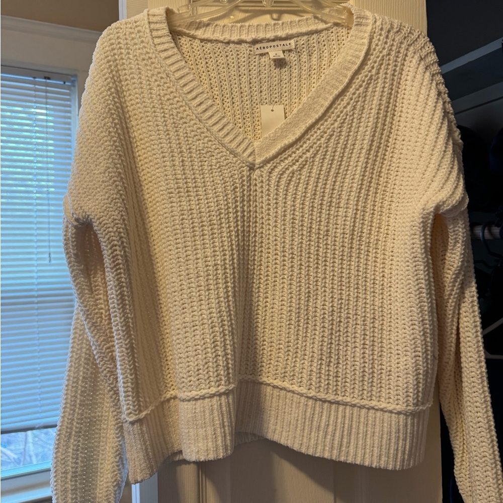 New with tags, cream sweater
